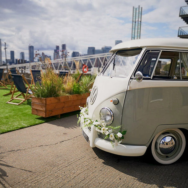1961 VW Spitscreen Camper dressed in wedding flower garlands in London