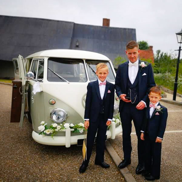 Groom and his two sons pose in front of our 1961 split screen camper