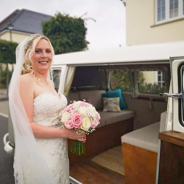 Bride about to get into classic VW camper